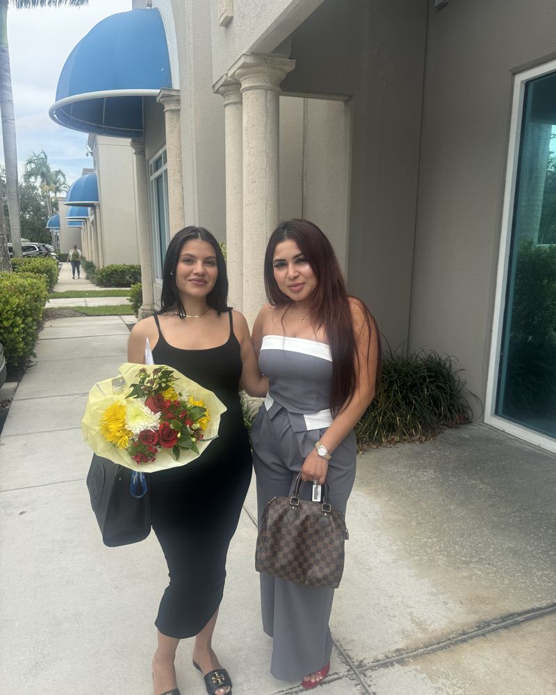 Cindy delivering flowers to a client