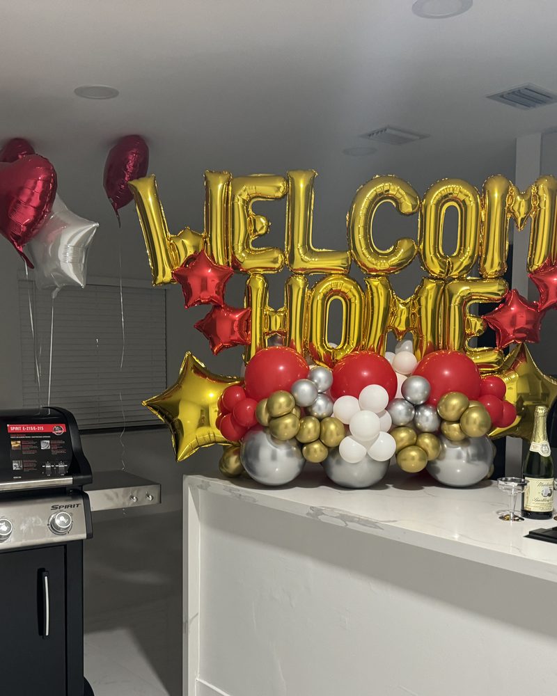 Gold welcome home balloons in a client's kitchen
